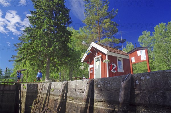 Small red wooden house in a lock, idyll, lockkeeper's house, Dalsland Canal, Sweden, Europe