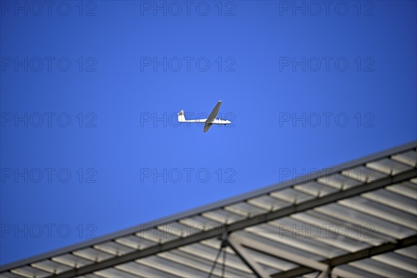 ASK 2 two-seater, D-6448, flies over stadium roof, sky, blue, PreZero Arena, Sinsheim,