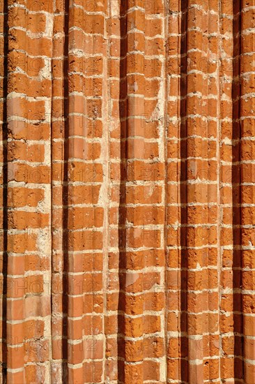 Fascia of a church portal with archivolts from the brick Gothic period, using the example of the