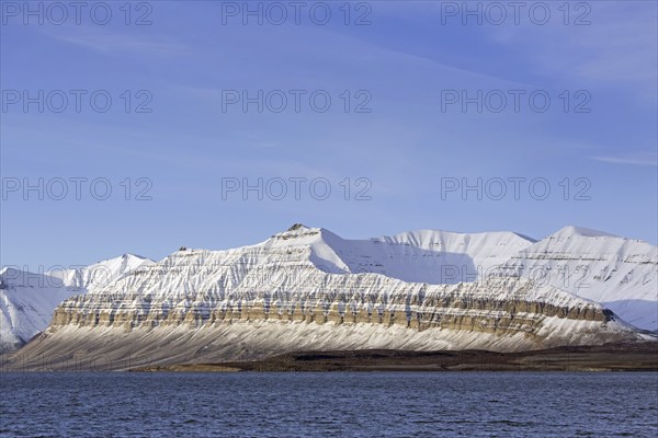 Snow covered mountains at Billefjorden, central fjord of the Isfjorden, Svalbard, Spitsbergen,