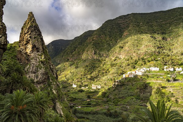 One of the twin rocks Roques de San Pedro, landmark of Hermigua, La Gomera, Canary Islands, Spain,