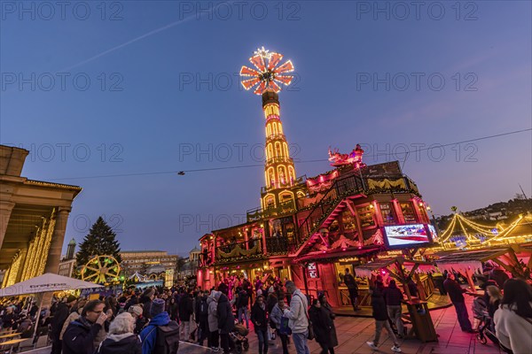 Stuttgart Christmas market at the blue hour. Christmas pyramid on the Schlossplatz in front of the