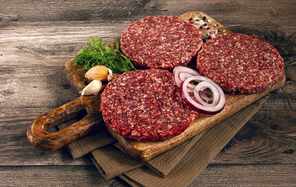 Raw cutlets, for burgers, minced meat, handmade, homemade, with spices, top view, no people
