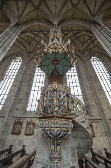 Pulpit with sandstone staircase in the late Gothic hall church of St George, Dinkelsbühl, Bavaria,