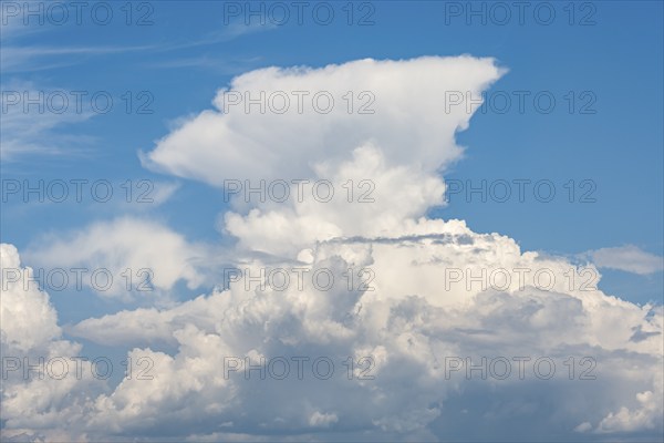 Cumulonimbus, thundercloud against blue sky, Germany, Europe