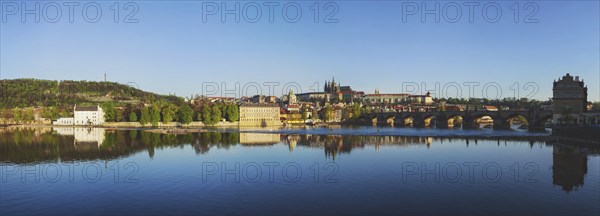 Panorama view of Charles bridge over Vltava river and Gradchany (Prague Castle) and St. Vitus