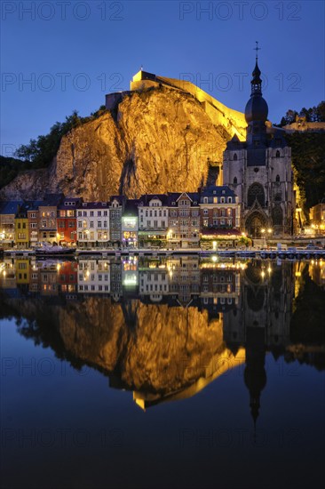 Night view of Dinant town, Collegiate Church of Notre Dame de Dinant over River Meuse and Pont