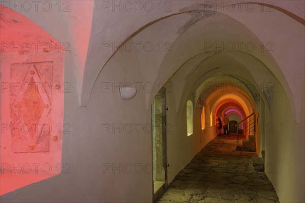 Colourfully illuminated cloister in the Carthusian monastery of Allerengelberg, Schnalstal Valley,