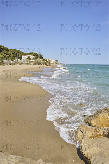 Breaking waves on a sandy beach, sunny, near Tarragona, Catalonia, Spain, Europe