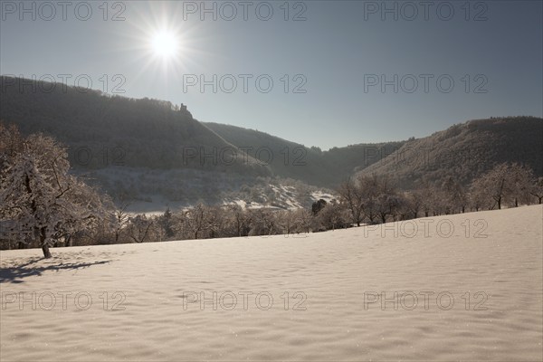 Bright blue sky in winter on the Swabian Alb near Neidlingen with a view of the Reussenstein castle