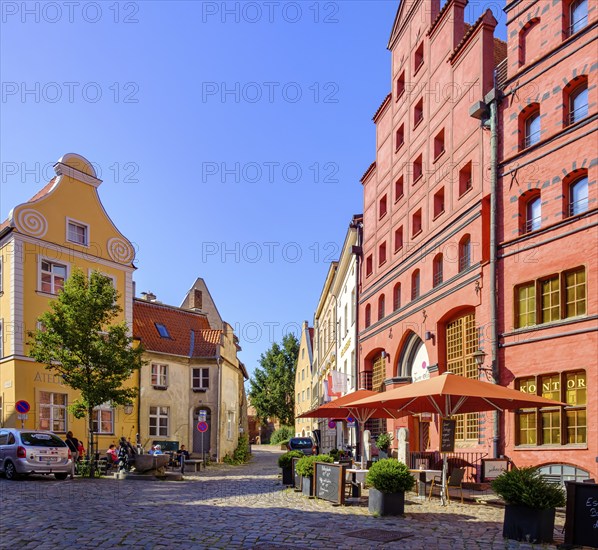 Street scene and historic building fabric with Gothic stepped gables and Baroque volute gables,