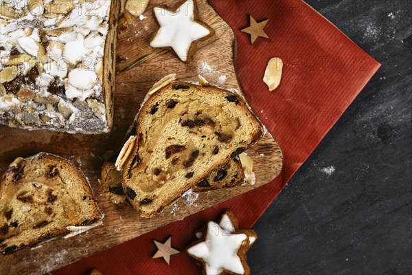 Top view of slice of German Stollen cake, a fruit bread with nuts, spices, and dried fruits with