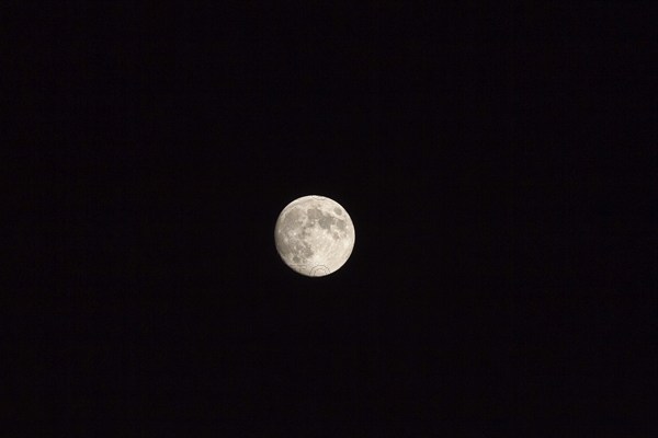 Full moon in the night sky, Arcachon, France, Europe