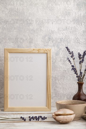 White wooden frame mockup with lavender in ceramic vase, linen textile, cup of coffee and bun on