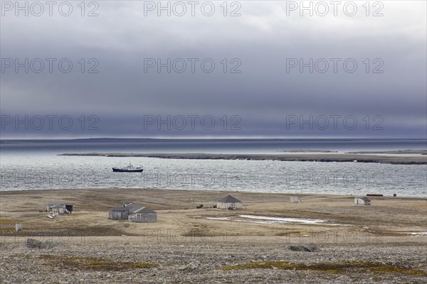 Wooden shacks and cabins at deserted 1950s Kinnvika Arctic research station, Murchisonfjord,