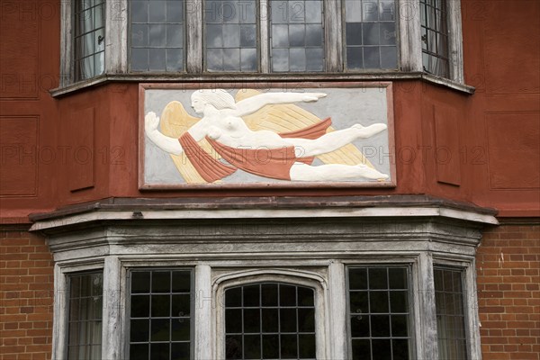 Pargeting plasterwork figure of a flying angel, Wyken Hall, Suffolk, England, UK