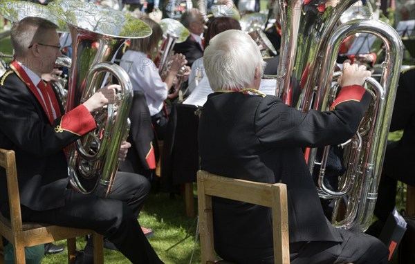 Musicians in a brass band perform during a country fair at Helmingham Hall, Suffolk, England,