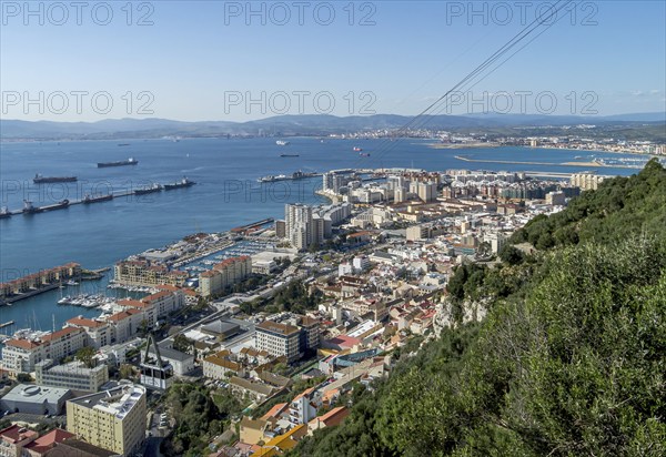 View of the city of Gibraltar and cable car near the top of the Rock of Gibraltar