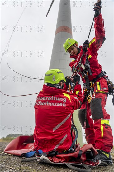 Height rescuers from the Oberhausen professional fire brigade practise abseiling from a wind