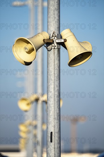 Loudspeakers, on masts, on the car park deck, for announcements, emergency messages, funnel