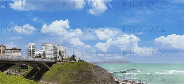 Peru, Lima, scenic ocean view and Miraflores Malecon promenade with shopping malls cafes and