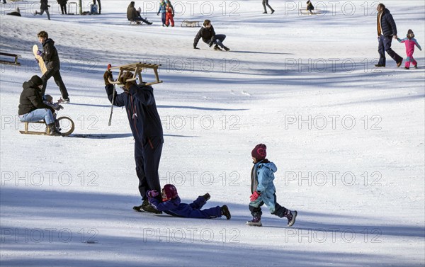 Tobogganing fun in Berlin's snow-covered Viktoriapark. Snow and icy cold continue to dominate the