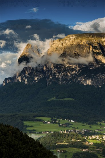 Sunset and mountain peaks in the clouds, Catinaccio, Dolomites, South Tyrol, Trentino-Alto Adige,