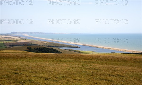 View west along Chesil beach tombolo from Abbotsbury to the Isle Portland, Dorset, England, UK