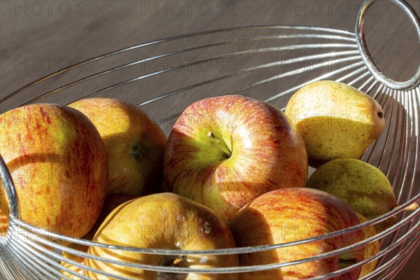 Close-up of apples and pears in the fruit basket