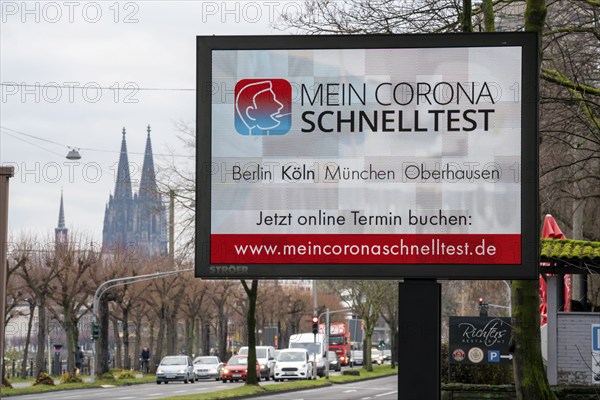 LED billboard, with digital advertising for Corona rapid tests, in the test centre in Cologne, on