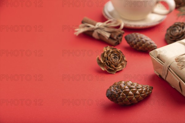 Christmas or New Year composition. Decorations, box, cinnamon, cones, fir and spruce branches, cup
