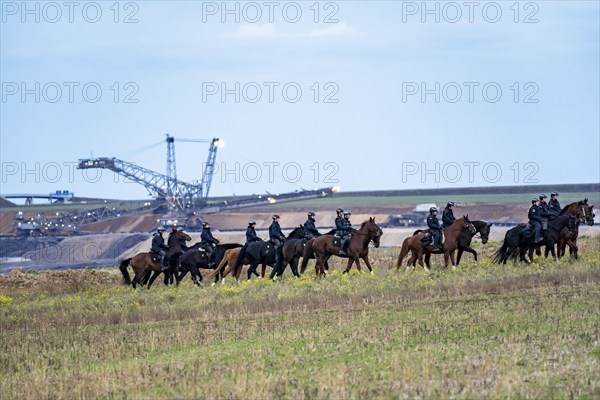 Police deployment, equestrian squadron, at the protest against the demolition of the village of