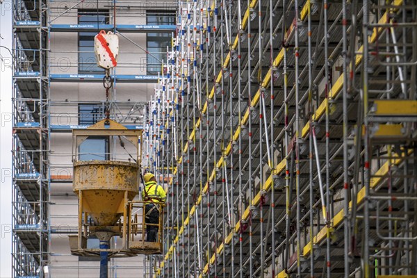 Concreting work on a construction site, new construction of a high-rise office building, facade of