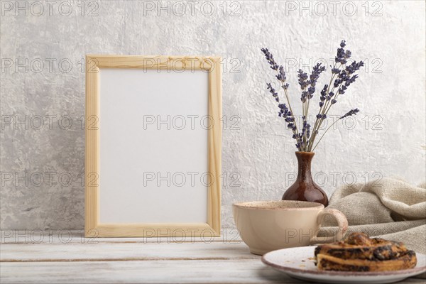 White wooden frame mockup with lavender in ceramic vase, linen textile, cup of coffee and bun on