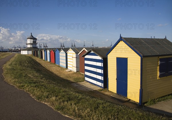 Colourful seaside beach huts and Low lighthouse maritime museum, Harwich, Essex, England, United