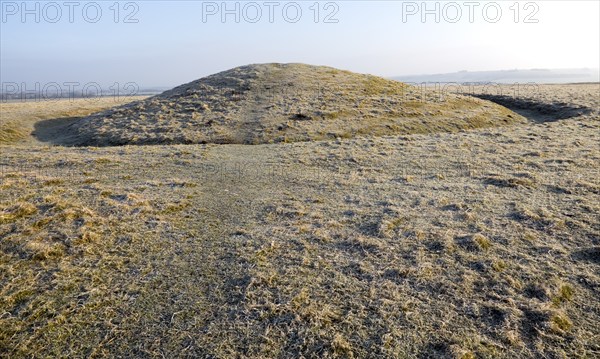 Bronze Age bowl barrow on Windmill Hill, a Neolithic causewayed enclosure, near Avebury, Wiltshire,
