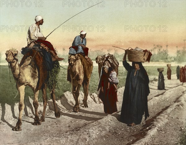 Cairo, farmers and woman on their way home from the fields, Egypt, digitally restored reproduction