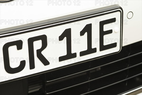 Black and white vehicle registration plate, licence plate, registration number of an electric car