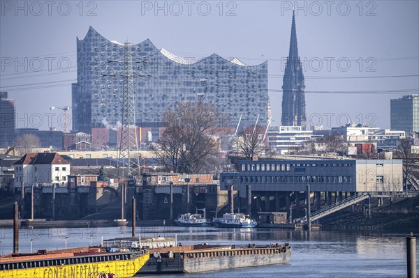 Hamburg harbour, Travehafen, water police station 2, working boats and barges, jetty, city skyline