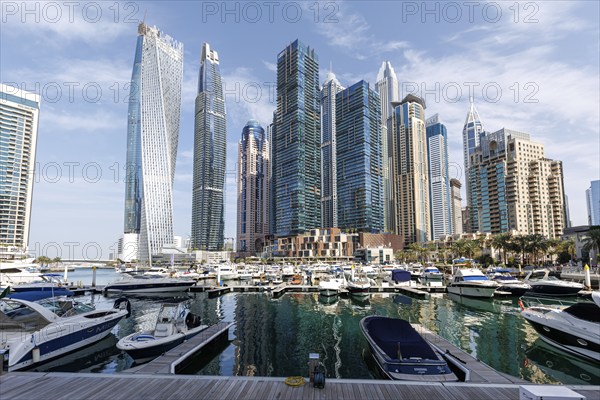 Dubai Marina skyline skyscrapers with yachts property skyscrapers living on the waterfront in