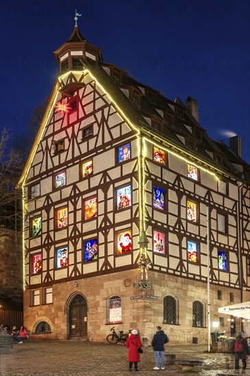 Pilatushaus, built in 1489, a historic town house with an Advent calendar on 18 December 2024 at