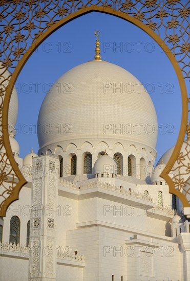 View through a window onto a dome of the Sheikh Zayed Mosque, Abu Dhabi City, Emirate of Abu Dhabi,