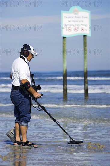 Man with metal detector, Daytona Beach, Florida, USA, North America