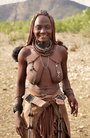 Young Himba woman with traditional jewellery, Ombombo, Kaokoland, Kunene, Namibia, Africa