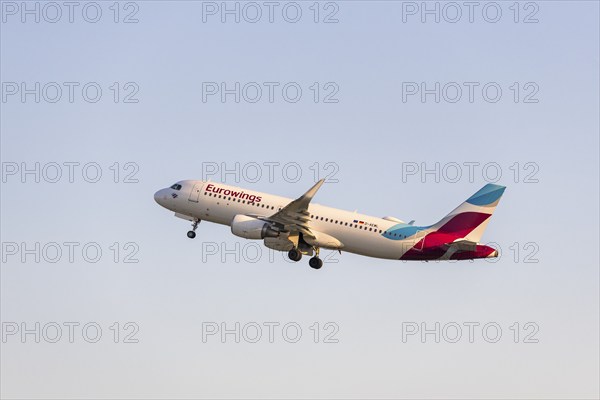 A Eurowings aircraft rises into the blue sky, symbolising the start of a journey,