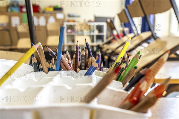Classroom of a fourth grade, after school, the building is older but in good condition, coloured