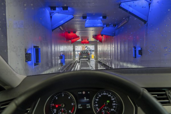 Car in an automatic car wash, car wash tunnel, drying