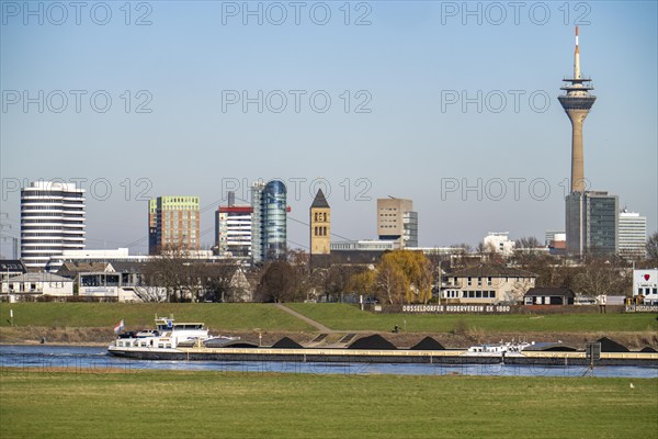 The skyline of Düsseldorf, with the skyscrapers in the Media Harbour, Rhine Tower, in front