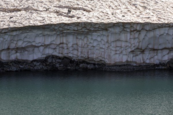 Remains of snow in Lake Sassolo, Lago di Sassolo, Sambuco Valley, Vale Sambuco, near Fusio,