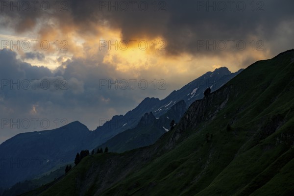 Summit in the morning light with dramatic clouds, Lech, Lechquellengebirge, Vorarlberg, Austria,